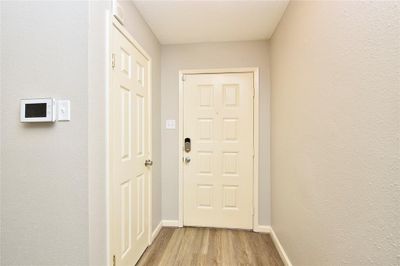 The entry to your new home: a coat closet is located just inside the entry for easy and spacious storage. Six panel doors throughout the home add an upgraded touch to the finishes. | Image 3