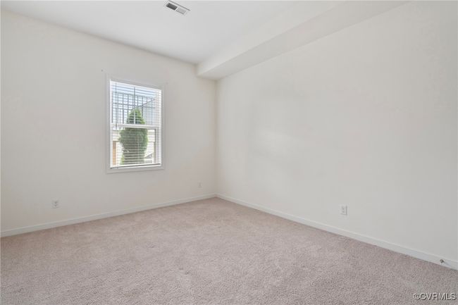 Spare room with light carpet and baseboards | Image 41