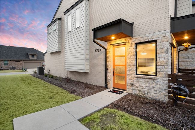 View of exterior entry featuring a yard and brick siding | Image 4