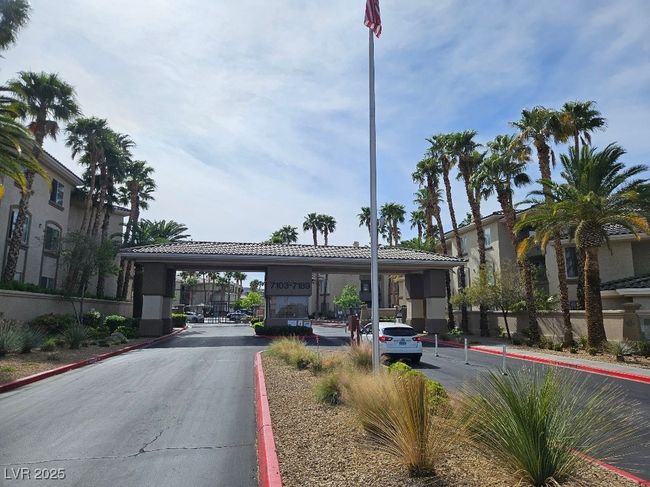 View of road featuring a gated entry and curbs | Image 34
