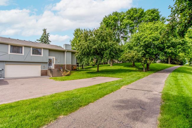 Take a walk or ride a bike down the conveniently located paved path right outside your front door. | Image 30