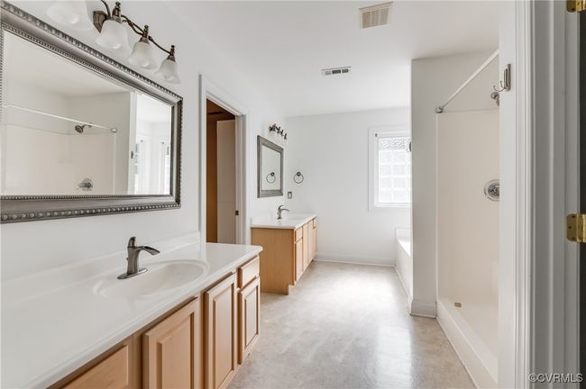 Primary bathroom with double vanities, shower (double showerheads) and soaking tub | Image 29
