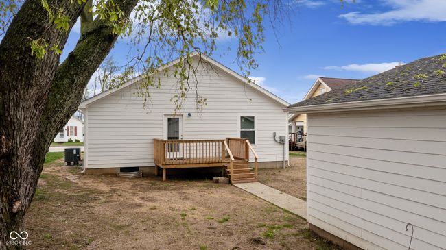back of house featuring a wooden deck | Image 10