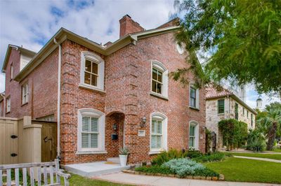 Beautiful brick facade on tree lined street | Image 1