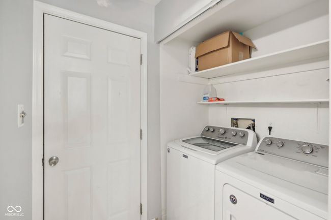 laundry area with laundry area and washer and clothes dryer | Image 20