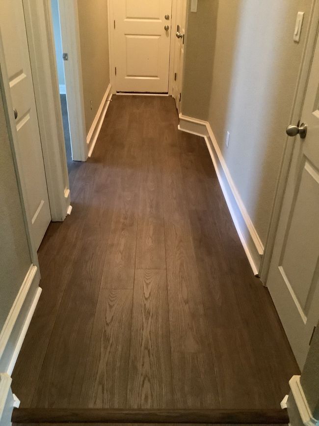 Hall with dark wood-style floors and baseboards | Image 5