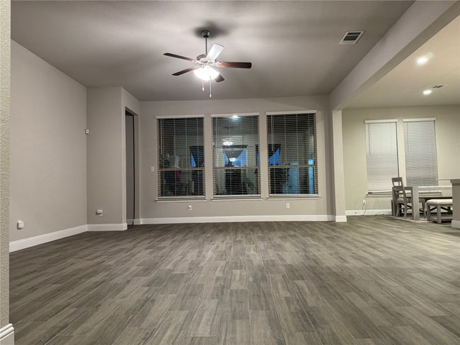 Unfurnished room featuring ceiling fan and dark hardwood / wood-style floors | Image 4