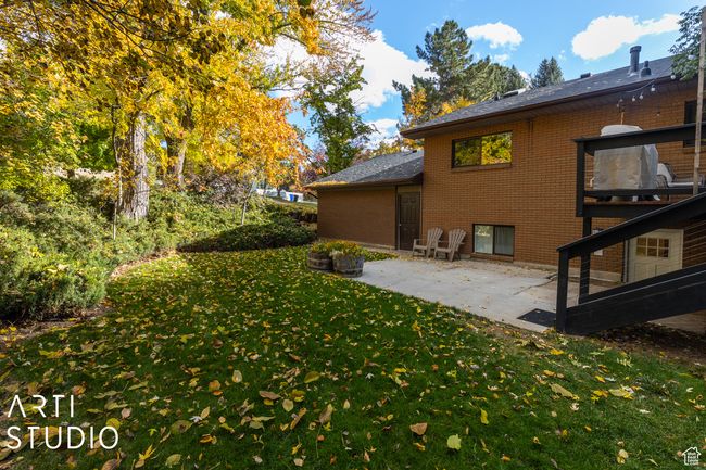 View of green lawn with a patio | Image 51