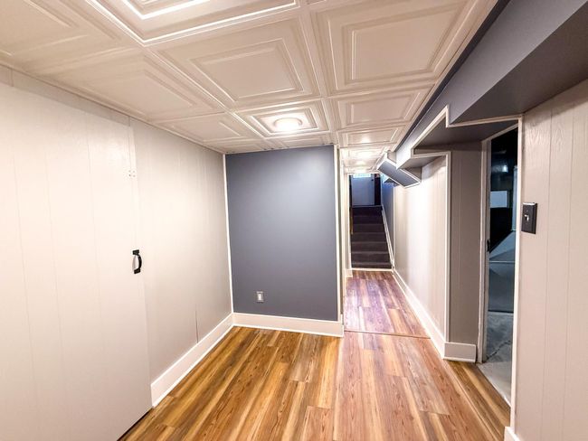 Lower level hall connects all of the rooms seamlessly | Image 29