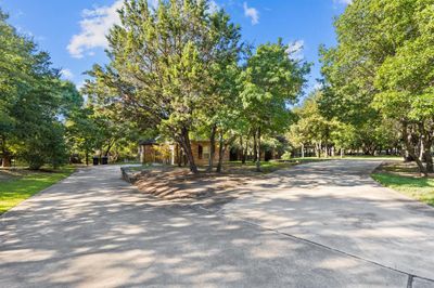 Craftsman-style house with a front lawn | Image 2