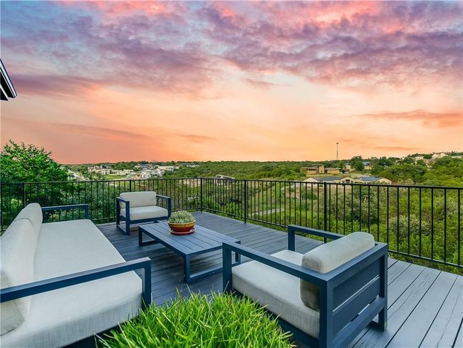 Deck at dusk with an outdoor living space | Image 4