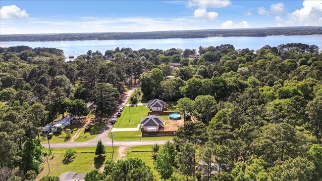 Drone / aerial view featuring a water view and a forest view | Image 36