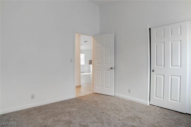 Bedroom with lofted ceiling, & a closet | Image 31