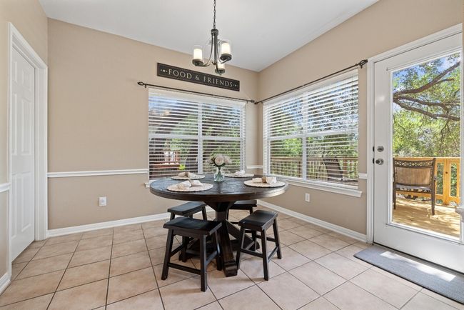 Wrapped in windows and surrounded by greenbelt views, the breakfast area feels like its own little escape—bright in the morning, calm in the evening, and just steps from the back deck | Image 16