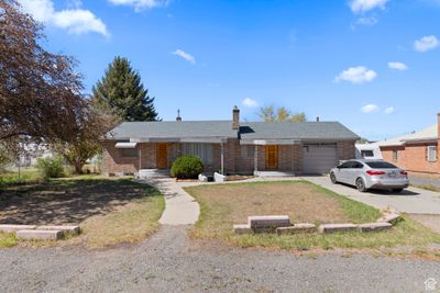 Single story home with a garage | Image 1