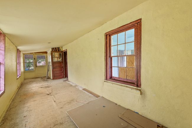 Doorway to property with stucco siding | Image 14
