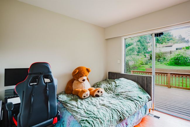 Bedroom featuring wood finished floors and visible vents | Image 16