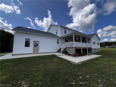 Rear view of house with a yard | Image 2