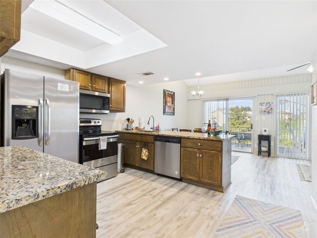 Stainless appliances and granite counter tops. | Image 5