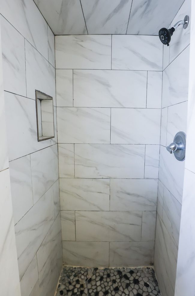 Full bathroom featuring tiled shower | Image 17