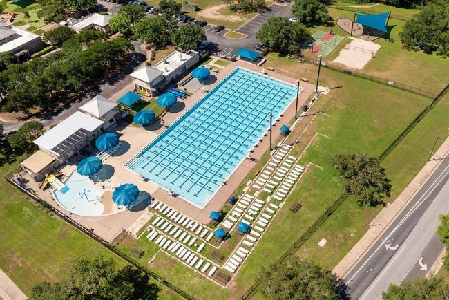 Pool with a yard and a water slide | Image 36