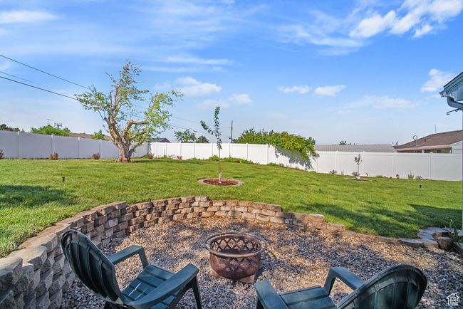 View of patio featuring a fire pit | Image 32