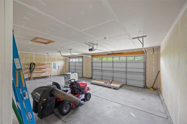 Garage featuring a garage door opener | Image 43