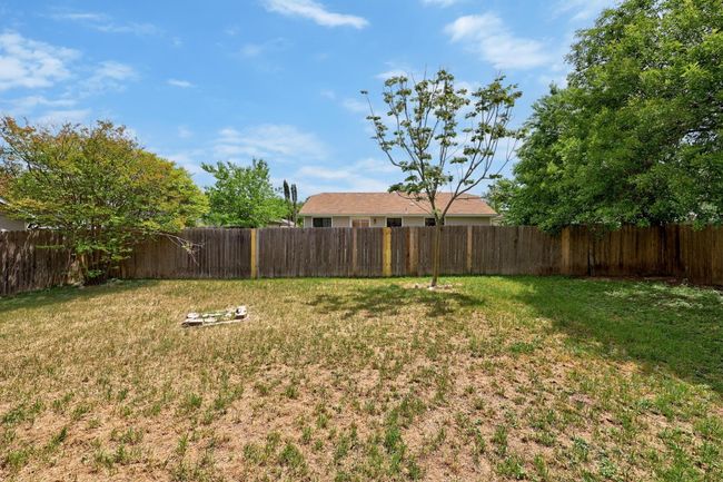 View of yard featuring a fenced backyard | Image 24