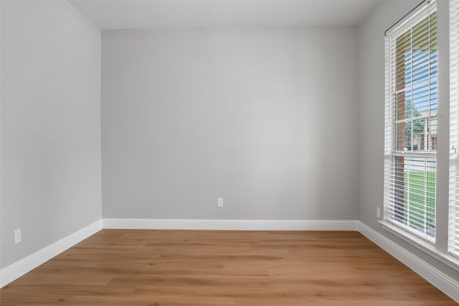 Spare room with light wood-style flooring, baseboards, and plenty of natural light | Image 22