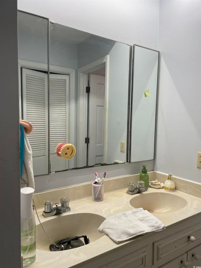 Bathroom with vanity and a closet | Image 19