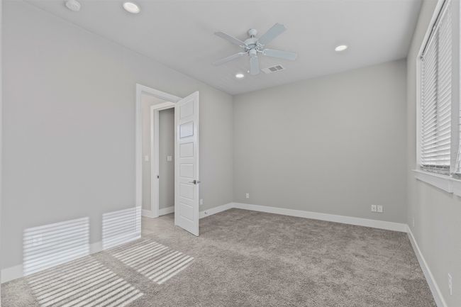 Unfurnished bedroom with carpet, recessed lighting, baseboards, and a ceiling fan | Image 12