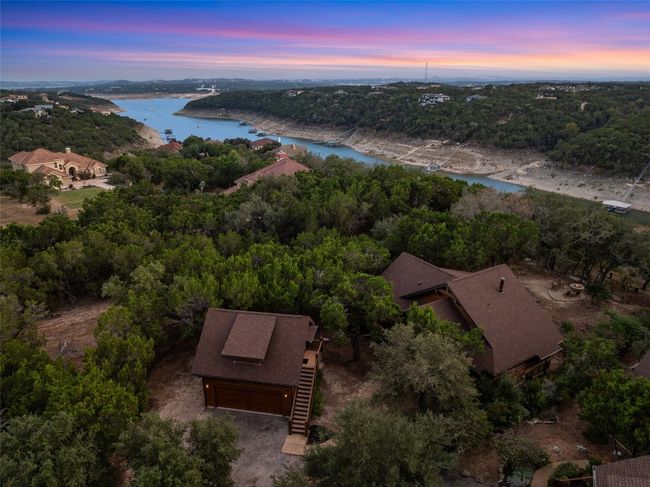 A stunning twilight aerial shot of the property, showcasing Lake Travis & Devils Cove. | Image 33