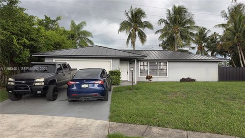 323 Canterbury Dr W, Riviera Beach, FL, 33407-1322 | Card Image