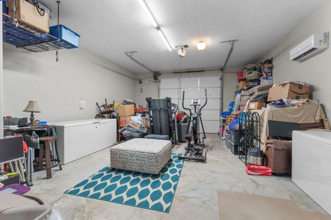 500 sq ft Detached Garage with a wall mounted AC and fridge | Image 26