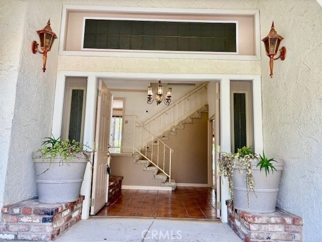 Grand entrance through double doors into foyer | Image 10