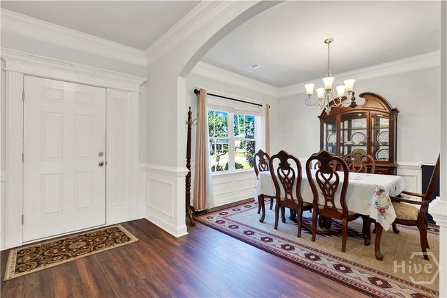 Beautiful trim work encasing the front door, Dining Room, Foyer and Flex Room!!! | Image 6