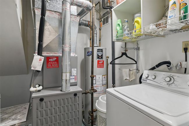 Laundry area featuring laundry area, washer / dryer, and utilities | Image 19