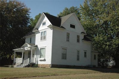 View of front of house with cooling unit and a front lawn | Image 3