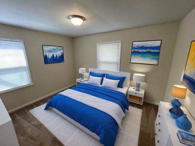 Carpeted bedroom featuring baseboards and multiple windows | Image 10