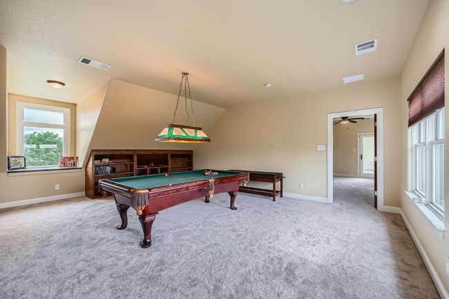 Huge room adjacent to 3rd guest room; can be living area for multi-family situation or game room | Image 22