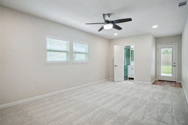 Cozy and spacious with plush carpet, recessed lighting, and natural light | Image 10
