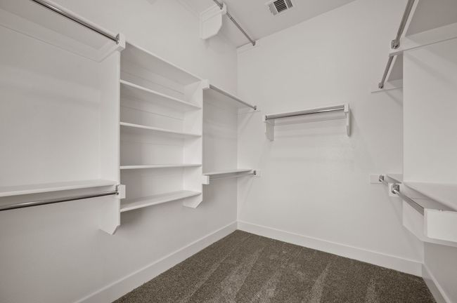 You'll find a wonderful owners closet complete with seasonal hanging racks in our Bella plan. | Image 14
