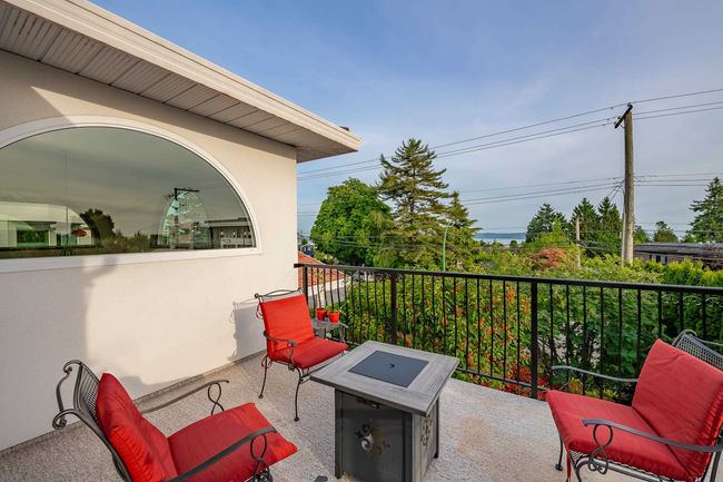 View of patio / terrace with an outdoor fire pit | Image 9