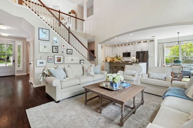 The stairway and second floor game room overlook the main living area making it easy to stay connected throughout the home. | Image 7