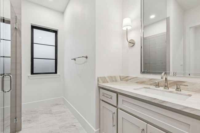 Bathroom with vanity, a shower stall, light marble finish flooring, and recessed lighting | Image 19