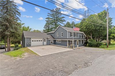 Lots of parking space! Owners have fit 8 cars in the driveway, when entertaining family and friends. | Image 3