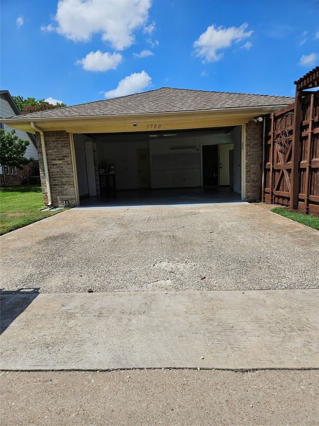 Garage featuring concrete driveway | Image 20