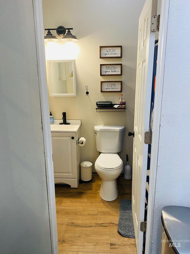 Bathroom featuring vanity and wood finished floors | Image 21