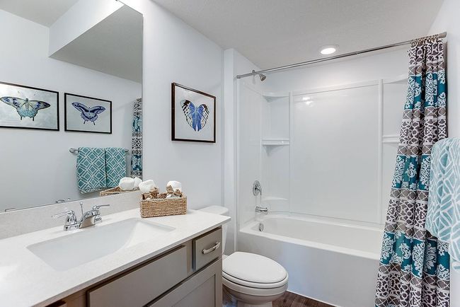 Included finished lower level with family room, bedroom and full bath. Photo is of similar home. Options and colors may vary. Ask Sales Agent for details. | Image 39