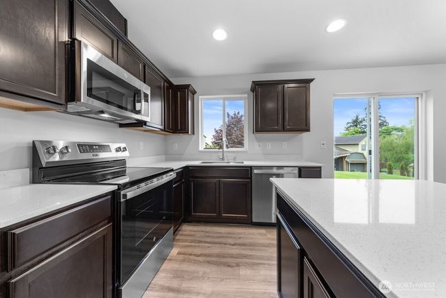 Photographs are for illustrative purposes only. Features, finishes, interior/exterior colors, landscaping and floorplan shown may vary from actual homes built. | Image 8